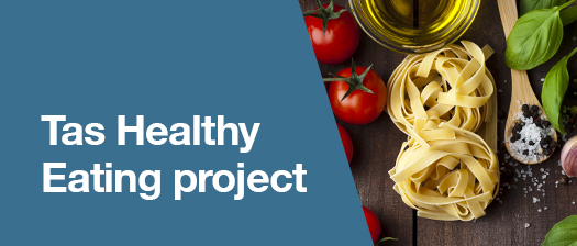 To the left are the words Tas Healthy Eating project in white letters on a blue background. To the right is an image of different foods including salt and pepper, tomatoes, pasta, cheese, garlic and basil