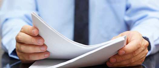 A business person holding a document