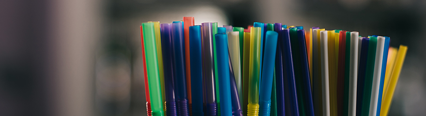 A bunch of colourful plastic straws