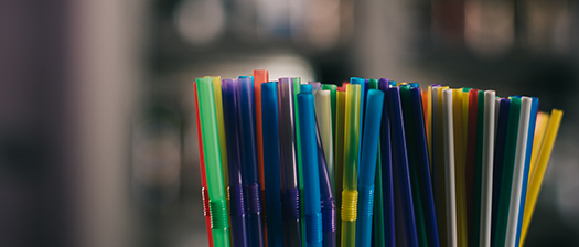A bunch of colourful plastic straws