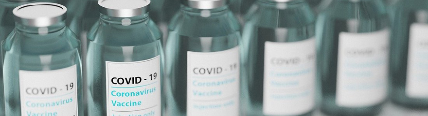 A row of vials labelled COVID-19 vaccine