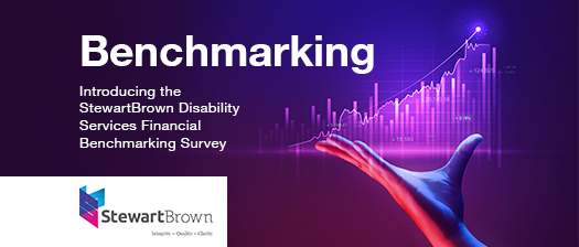 Background is a purple graph with a human hand open underneath it. In white text it says Benchmakring, Introducing the StewartBrown Disability Services Financial Benchmarking Survey.