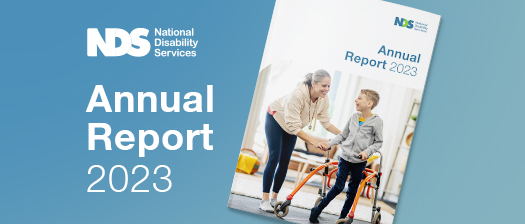 NDS Annual Report 2023 cover image of support worker and boy with disabilities