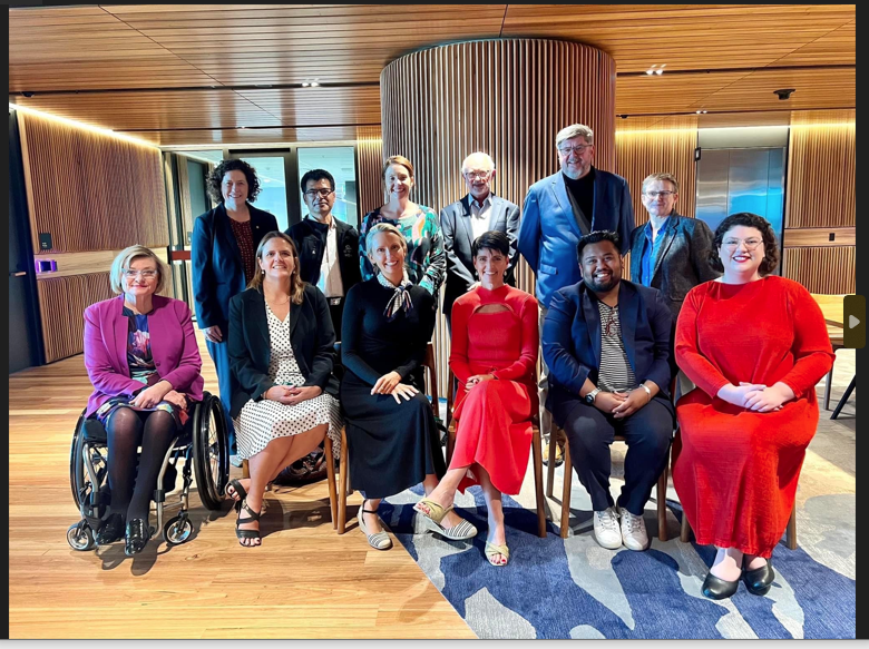 Minister Kate Washington (seated centre in red) with attendees at the first Disability Stakeholder forum for the Minns Government. 